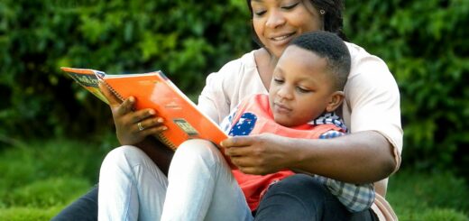 a woman reading a book to a child